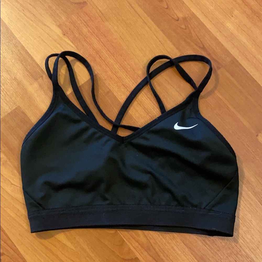 Black Nike sports bra with white Nike swoosh